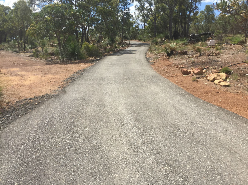This is a photo of a hot spray & seal bitumen driveway which is in the process of being installed by Beaudesert Asphalt & Bitumen Surfacing