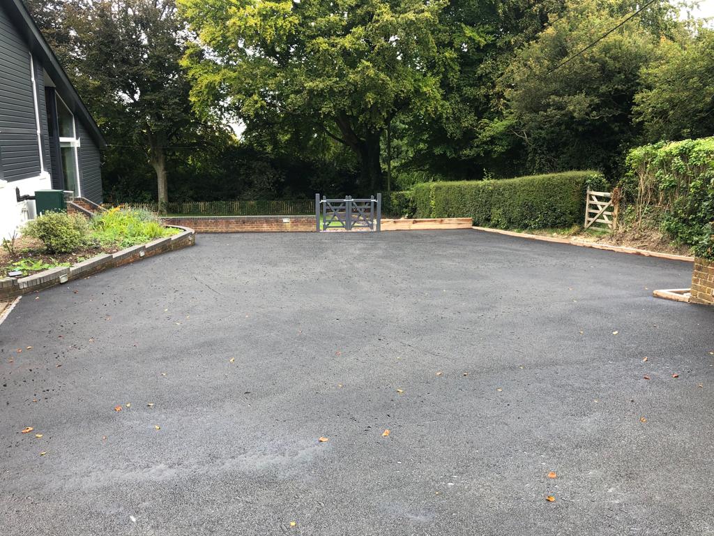 This is a photo of a bitumen driveway which is in the process of being installed by Beaudesert Asphalt & Bitumen Surfacing