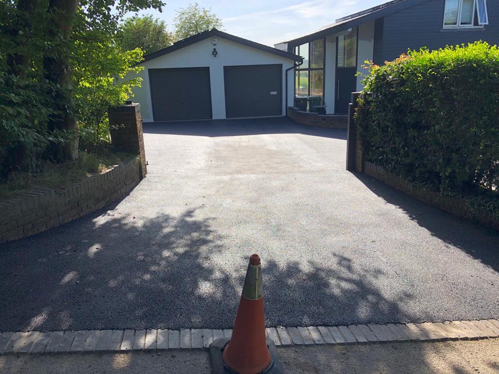 This is a photo of a bitumen driveway which is in the process of being installed by Beaudesert Asphalt & Bitumen Surfacing